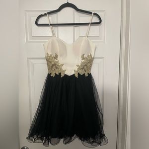 White, black, and gold homecoming dress